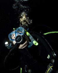 A divers bubbles reflecting torch light.

A simple imag... by Cal Mero 